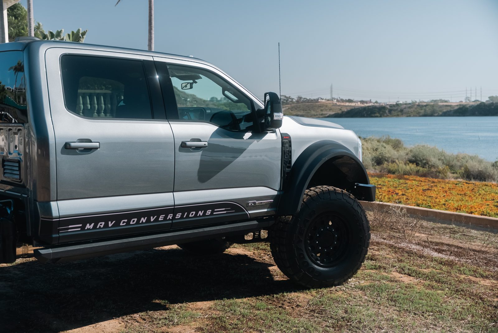 Side view of a MAV Conversions Ford F-550 cab chassis with the MAV Conversions rocker graphic