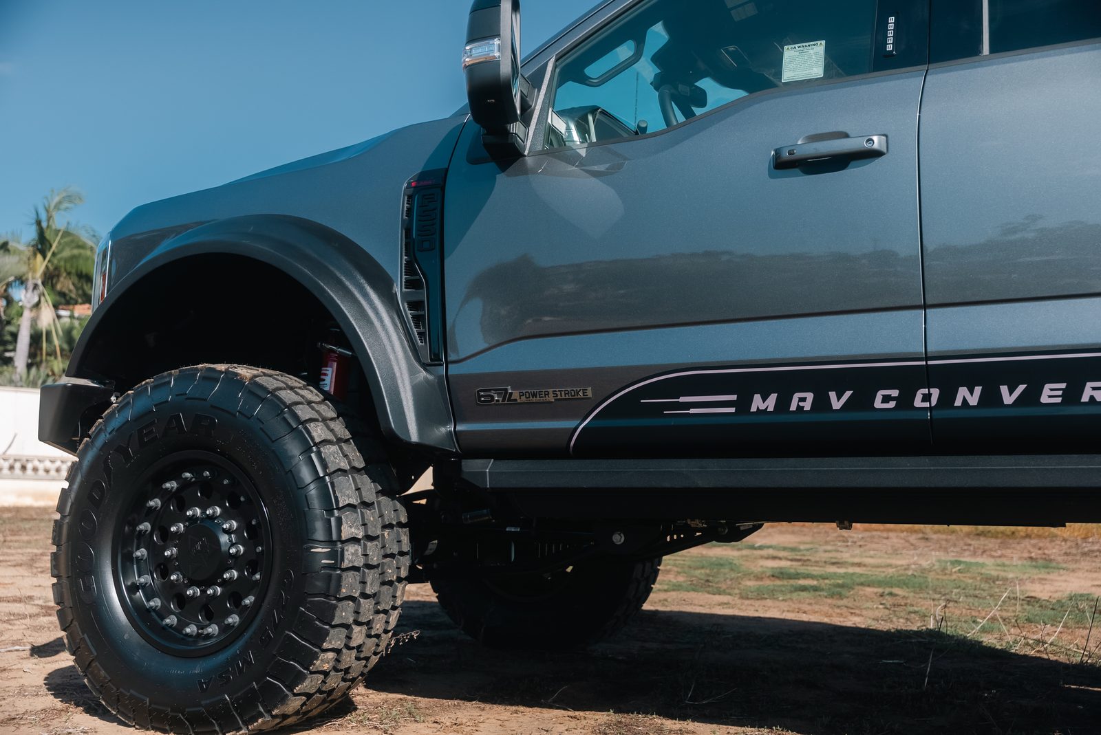 Front wheel and fender of a converted Ford F-550, showing the lift and tire clearance